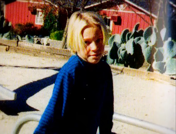 Young Jenna Miscavige in a playground wearing a blue sweater, associated with ex-Scientologist's claims of "creepy" song and brainwashing.