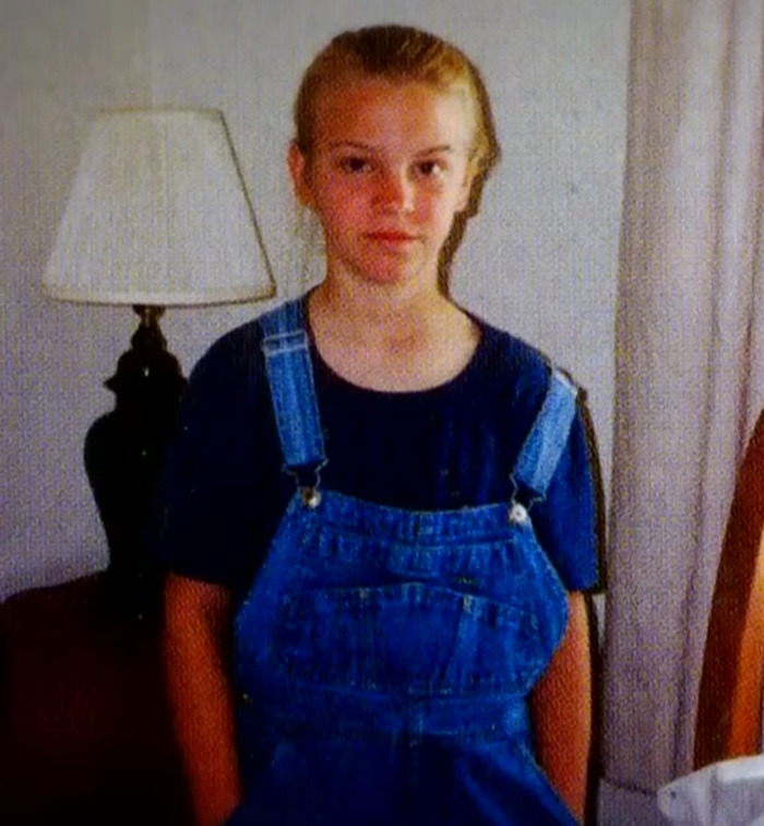 Young Jenna Miscavige standing indoors in overalls, related to ex-Scientologist's claims about a "creepy" song and brainwashing.