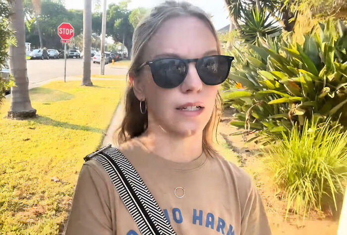 Ex-Scientologist Jenna Miscavige wearing sunglasses walking outdoors, sharing insights on Scientology and alleged brainwashing practices.