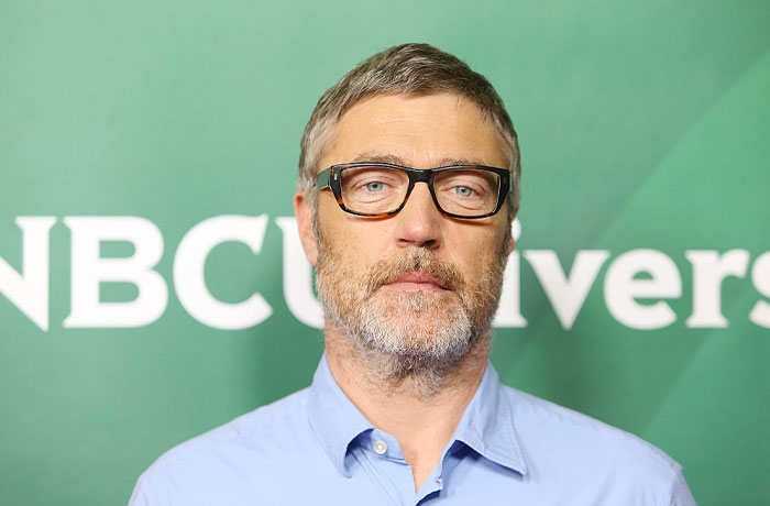 Man in glasses and blue shirt at NBC event, related to Aquaman 2 cast.