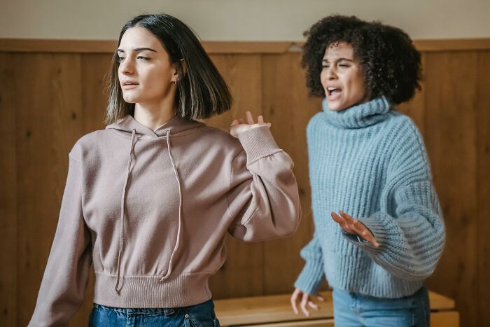 Two women having a disagreement, illustrating bad-good-habit dynamics.