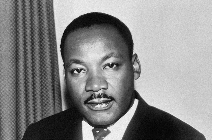 Black and white photo of a man in a suit, related to school presentations topic.