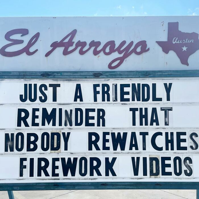 El Arroyo sign with a humorous message about rewatching firework videos.