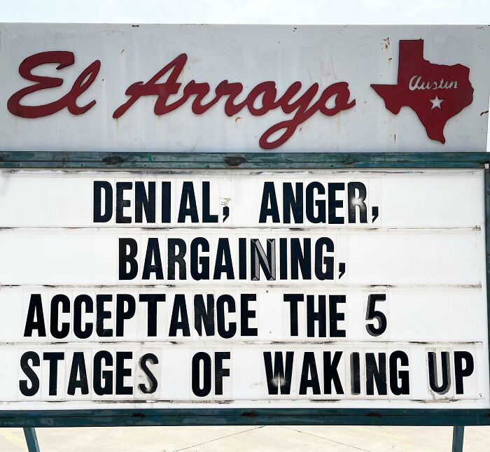 El Arroyo sign humorously lists the 5 stages of waking up: denial, anger, bargaining, acceptance.