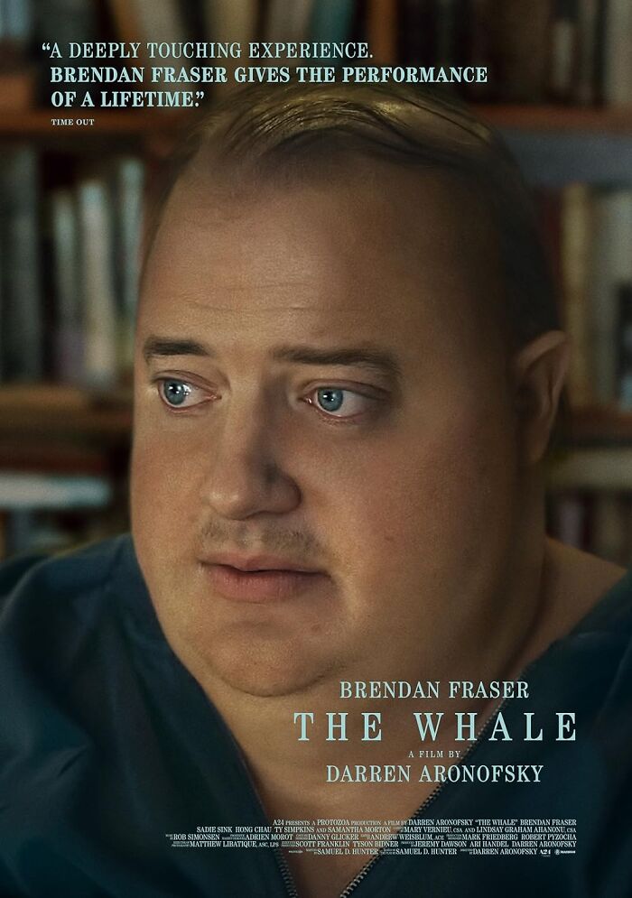 Brendan Fraser in "The Whale" promotional poster, depicting a reflective expression, surrounded by books.