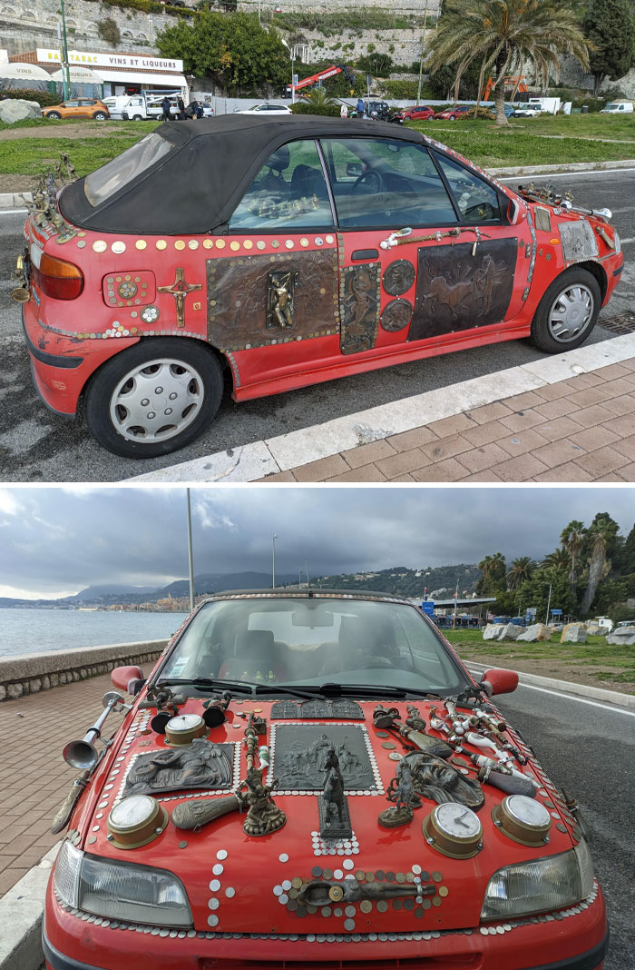 Red car covered in eclectic decorations, showcasing a unique car-fail theme.