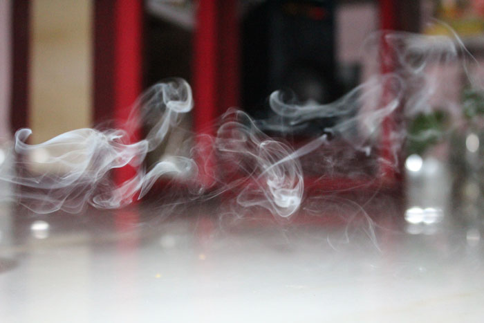 Smoke fills a hotel room, illustrating a family's harrowing experience.