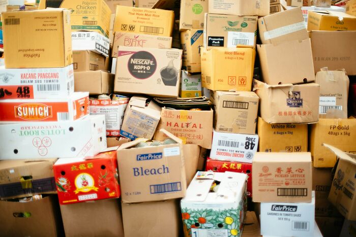 Stack of reused boxes for storage, showcasing habits developed by people in poverty.