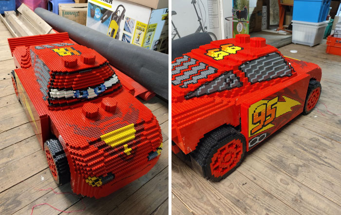 Cool LEGO builds of a red race car with number 95 on a wooden floor in a workshop setting.