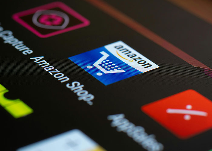 Amazon app icon on a digital screen, illustrating CEO management challenges.