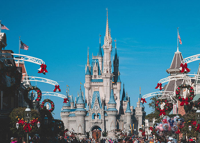 Disney Castle decorated for holidays; a symbol amidst CEO management challenges.