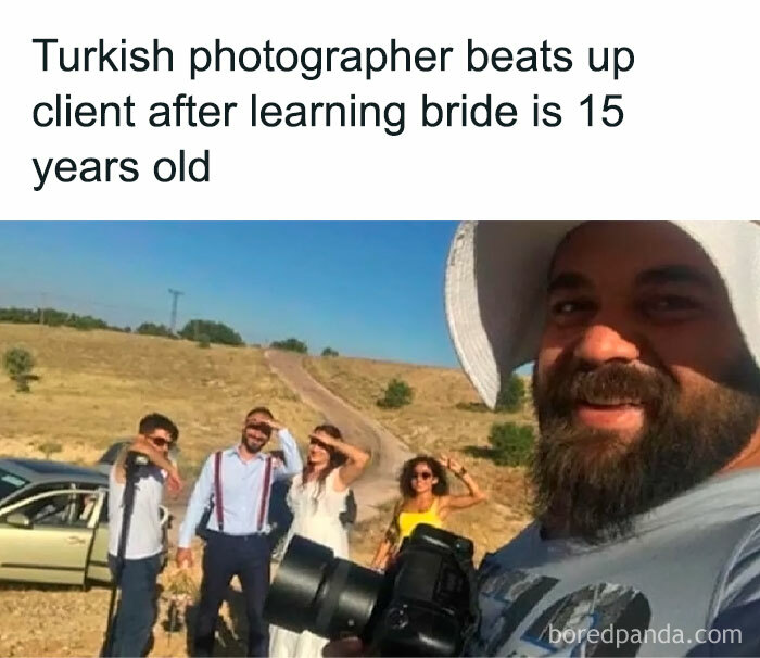 Photographer in a field with clients, showcasing a bold example of chaotic good.