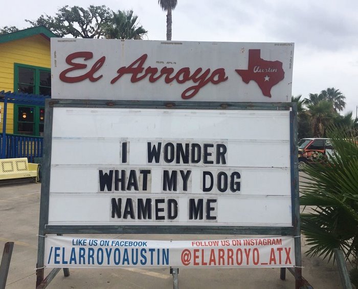 El Arroyo sign with humorous message: "I wonder what my dog named me" in front of a Texas-themed restaurant.