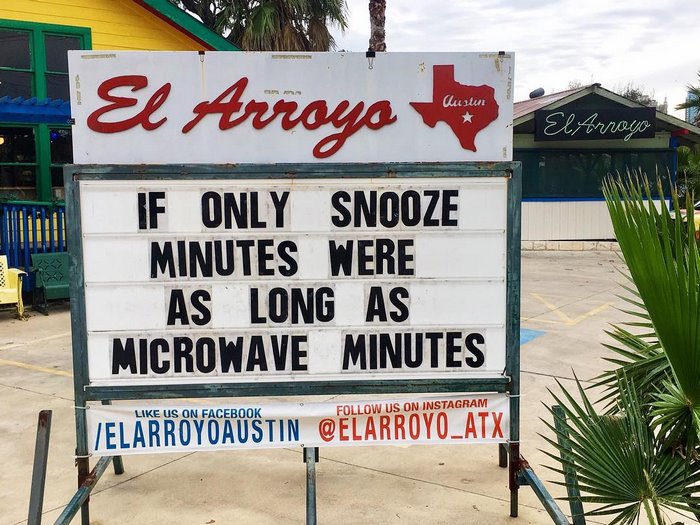 Sign at El Arroyo with humorous message about snooze and microwave minutes.