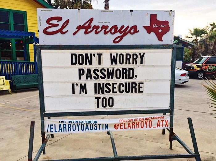 Humorous El Arroyo sign reading "Don't worry password, I'm insecure too" in front of restaurant.