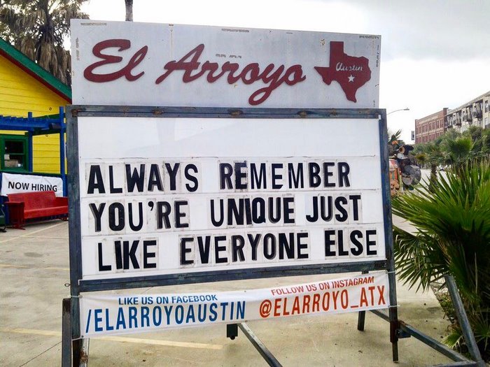 El Arroyo sign with humorous message: "Always remember you're unique just like everyone else."