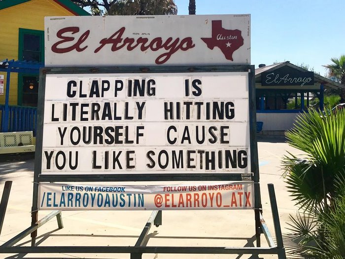 El Arroyo sign with humorous message: "Clapping is literally hitting yourself cause you like something."