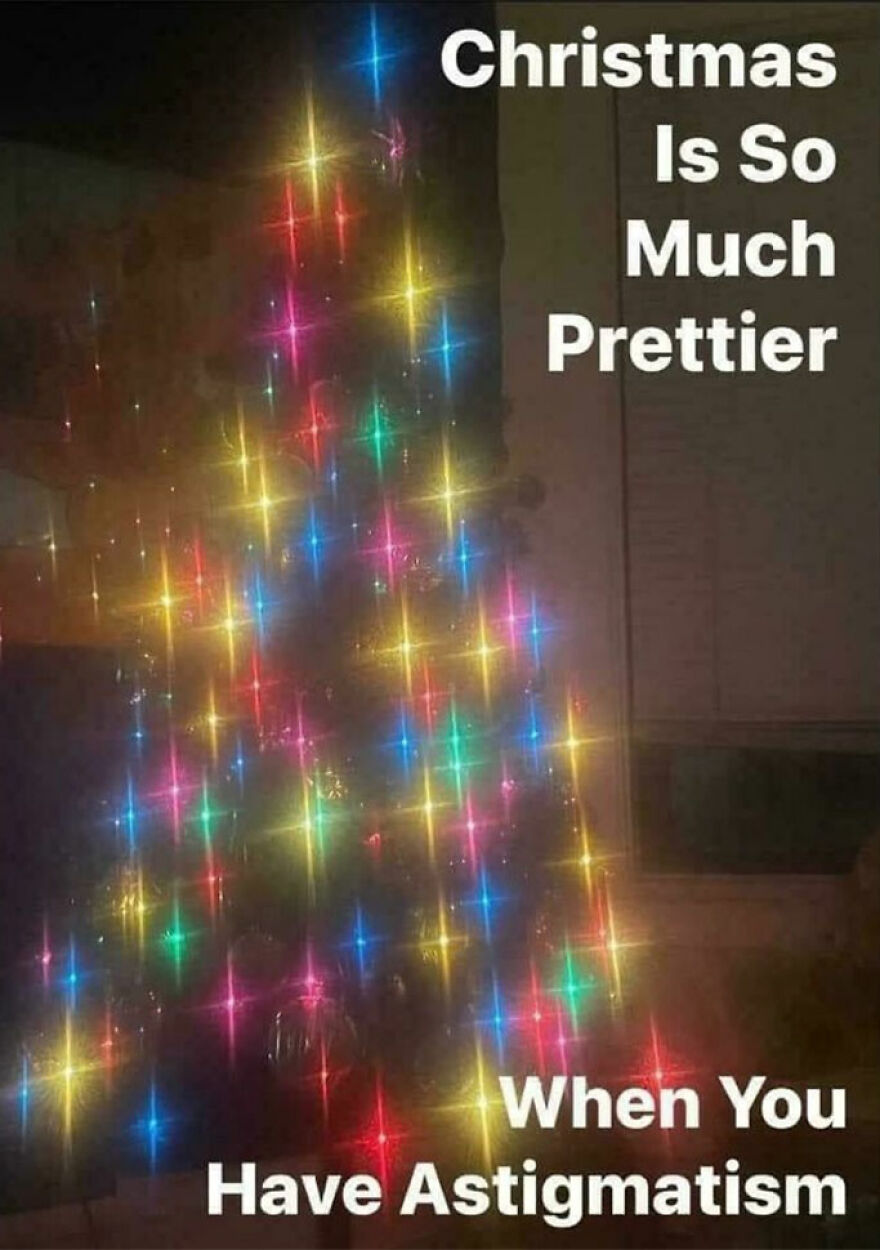 Funny Christmas meme with a blurry Christmas tree lit by colorful lights, captioned "Christmas Is So Much Prettier with Astigmatism."