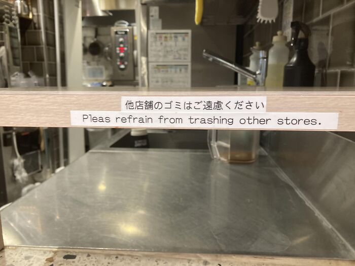 Sign in Japanese kitchen humorously mistranslated to "Please refrain from trashing other stores."