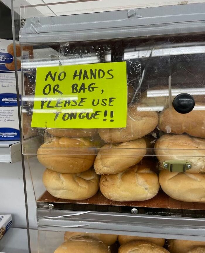 Bread display in New York with a funny sign: "No hands or bag, please use tongue!"