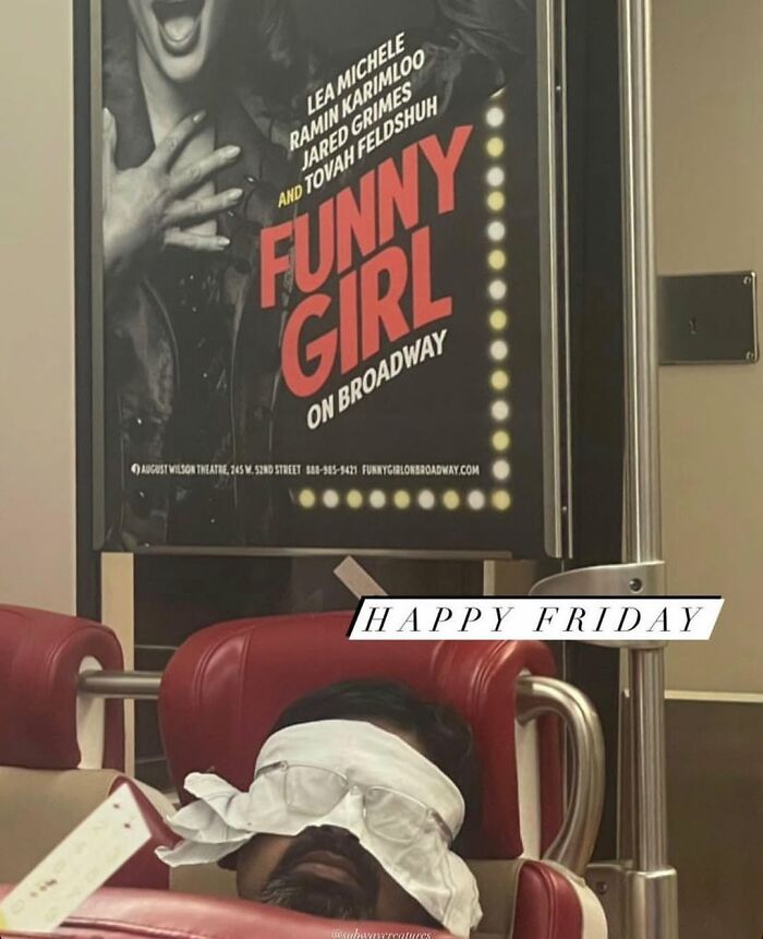 Person napping on a New York subway under a "Funny Girl on Broadway" poster.