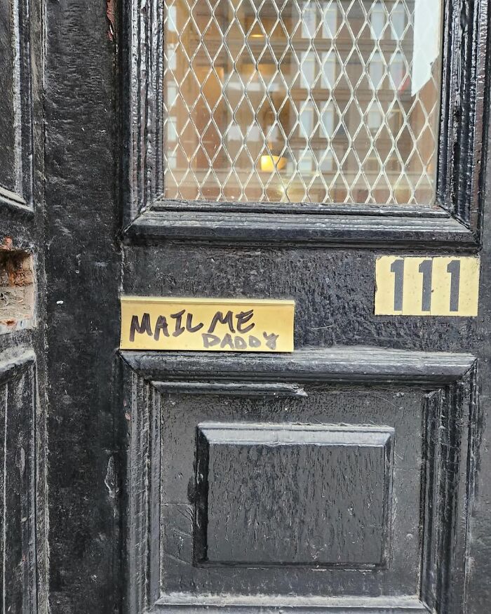 Black door with humorous "Mail Me Daddy" sign, part of funny pics in New York.