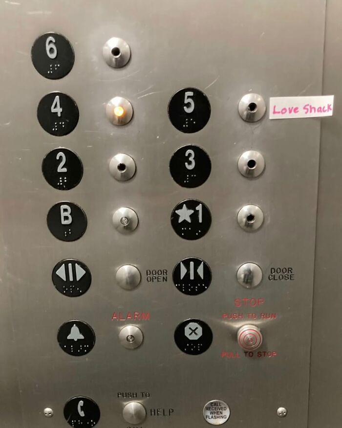 Elevator panel with humorous "Love Shack" label in New York.