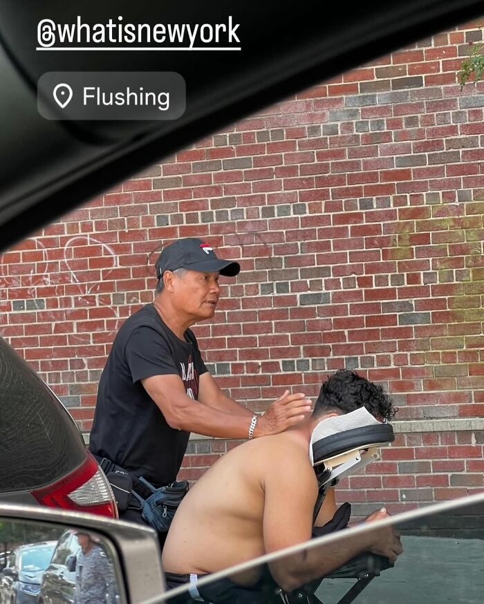 Street massage in New York, Flushing area, with a masseur giving a chair massage outdoors.