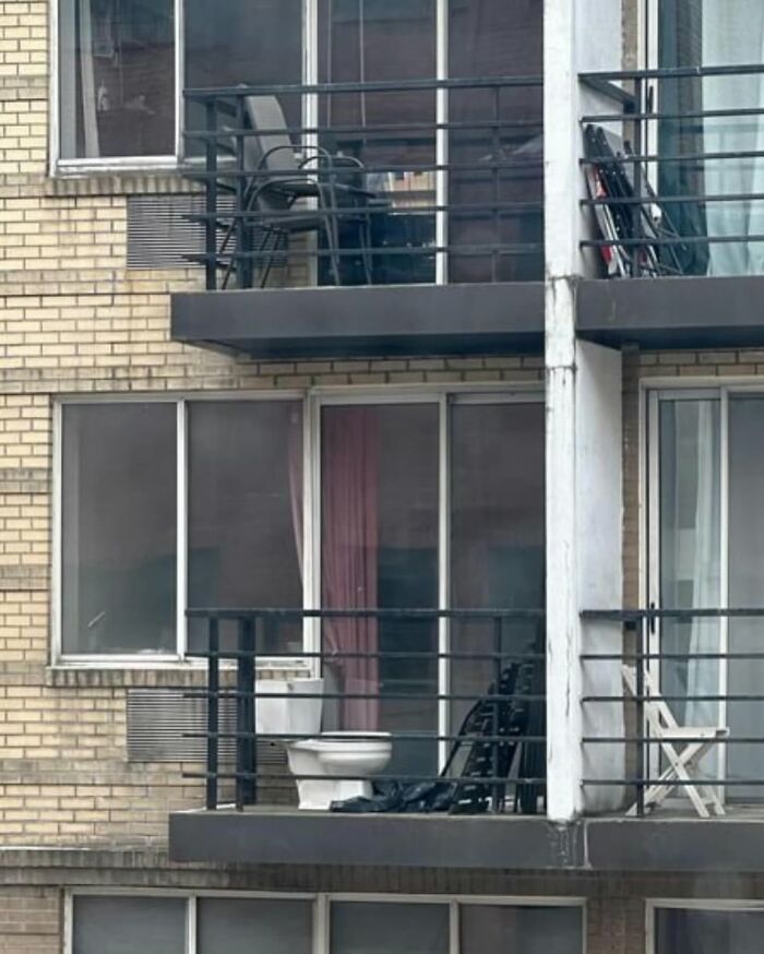 Balcony with unusual toilet placement in New York.