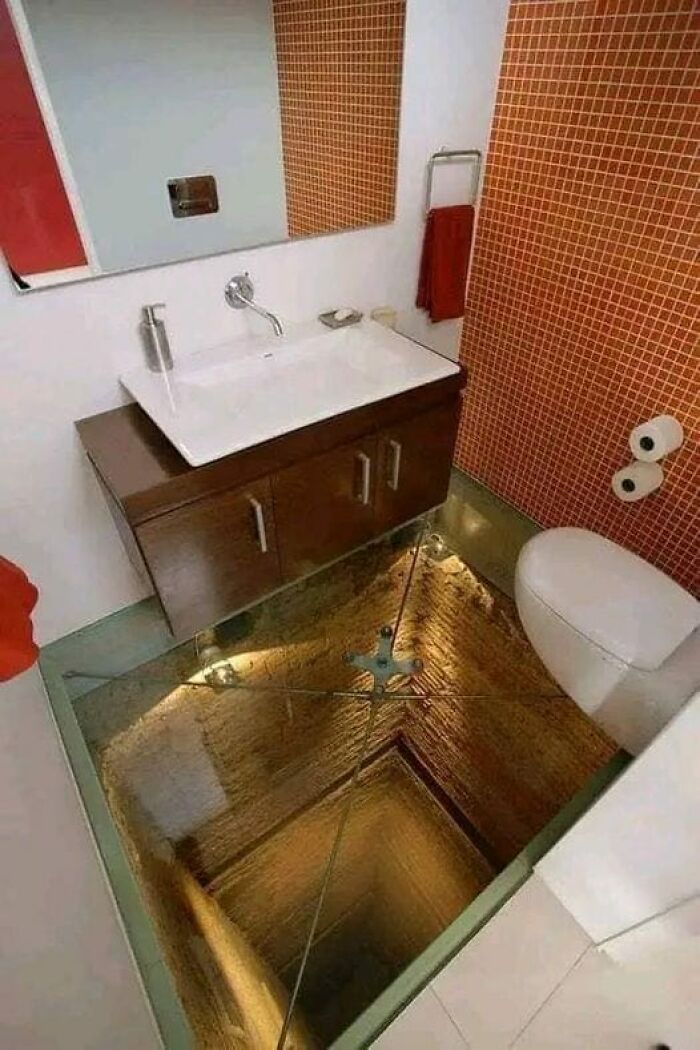 Bathroom With A Glass Floor Over Abandoned Elevator Shaft