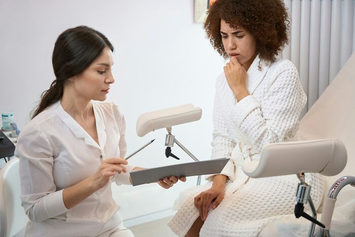 Doctor discussing medical options with a concerned patient, highlighting current practices potentially seen as barbaric in the future.