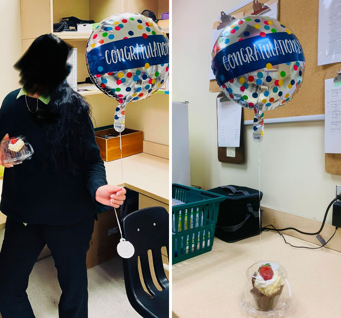 Person holding a "Congratulations" balloon and cupcake; office setting humor with good-funny-bosses theme.