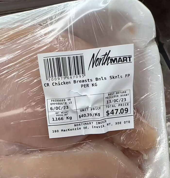 Packaged Arctic groceries; chicken priced at $47.09 for 1.166 kg, highlighting high cost in Northern regions.