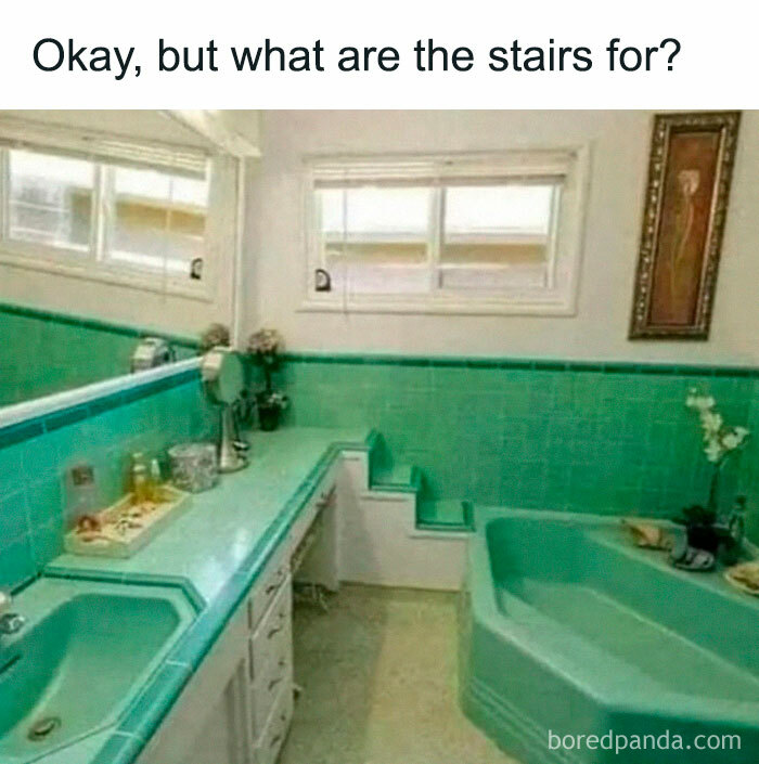 Stairs leading into a bathtub in a teal-tiled bathroom, showcasing a funny home design fail.