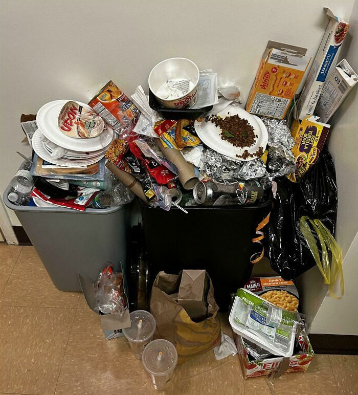 Overflowing trash bins with scattered food containers, highlighting horrible roommates’ mess.