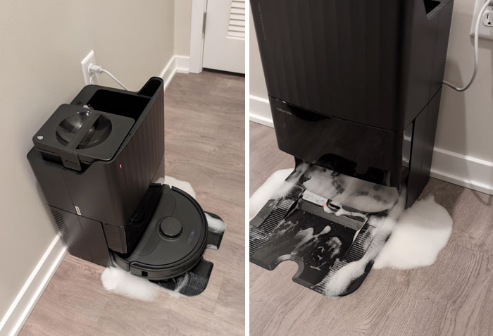 Robot vacuum overflowing with soap suds, illustrating a typical horrible roommates scenario.