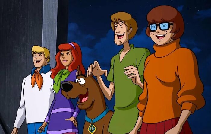 Animated group of characters, including a dog, smiling against a dark sky. Fascinating fan theories often surround them.