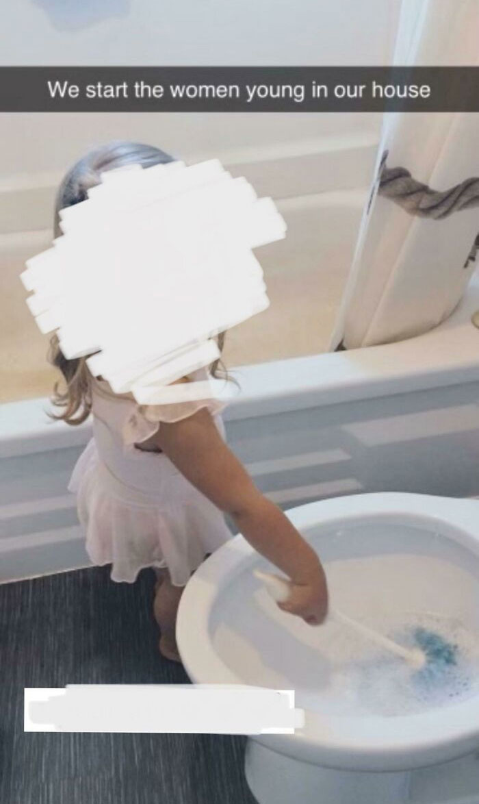 A young child in a bathroom cleaning a toilet, reflecting ignorant-parents' perspective.