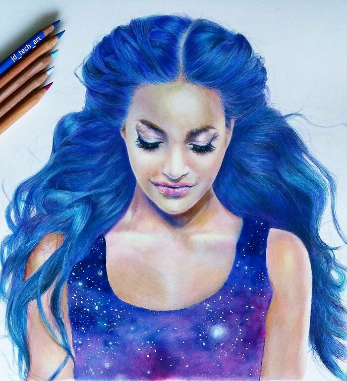 Hyper-realistic drawing of a woman with blue hair, wearing a galaxy-themed dress, surrounded by colored pencils.