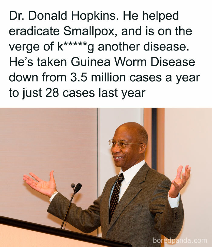 Man in a suit speaks at a podium, discussing interesting facts about disease eradication.