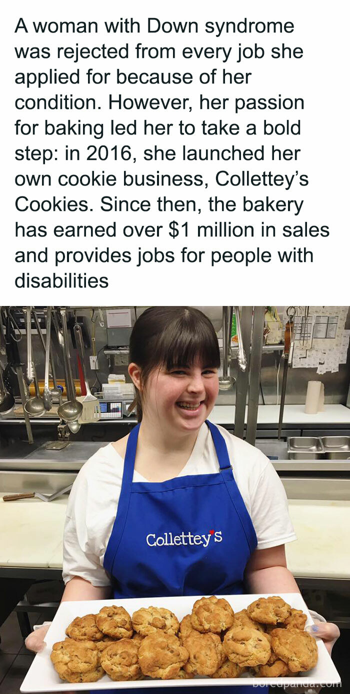 Woman with Down syndrome proudly holding trays of cookies, showcasing her successful bakery business as a stress-relief story.