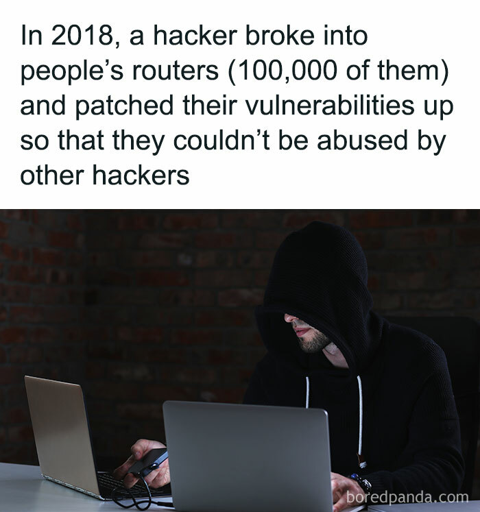 Hacker in a dark room, wearing a hoodie, typing on a laptop, highlighting interesting facts about cybersecurity.