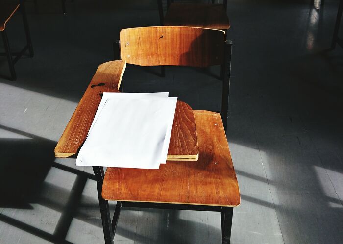 A right-handed desk design highlighting left-handed people struggles with usability.