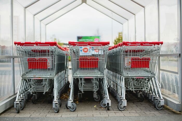 Shopping carts neatly arranged in a row, an example of things people judge others for when left unreturned.