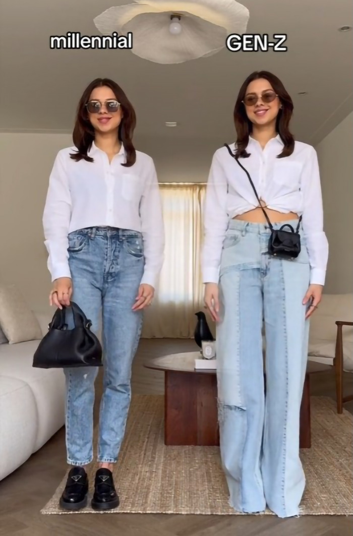 Millennial with Gen Z style expectations, wearing white tops and jeans, standing in a modern living room.