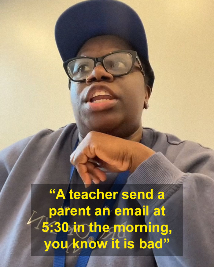 Person in glasses and cap discusses a teacher's email on child's behavior at school.