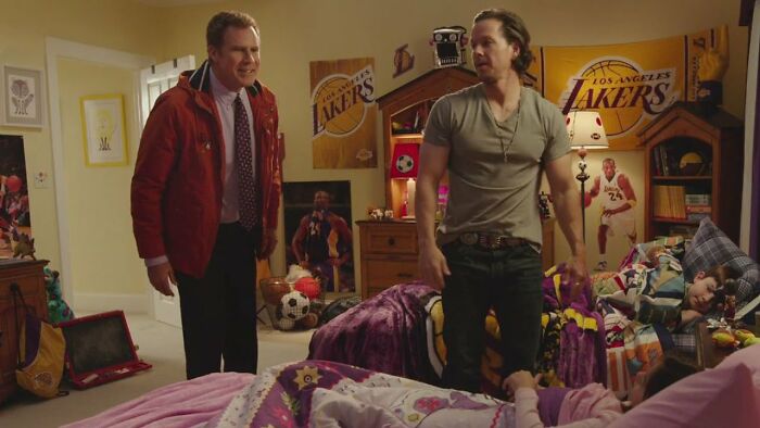 Two men in a sports-themed children's bedroom, reflecting movies' portrayal of women.