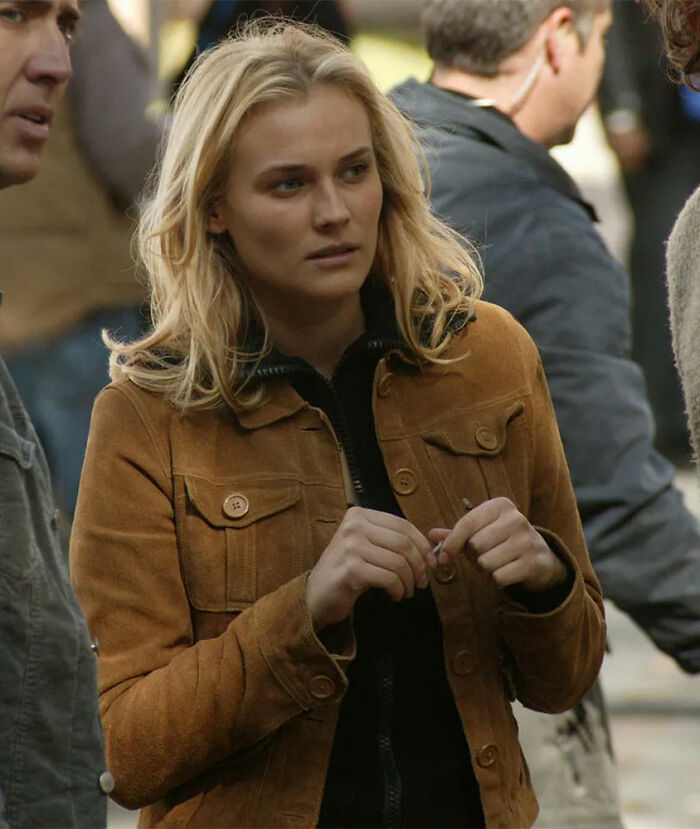 Woman in a brown jacket standing outdoors, representing movies' portrayal of women.