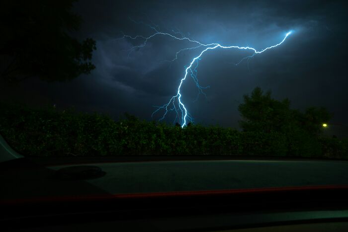 Lightning bolt in dark sky, symbolizing incredibly lucky survival against all odds.