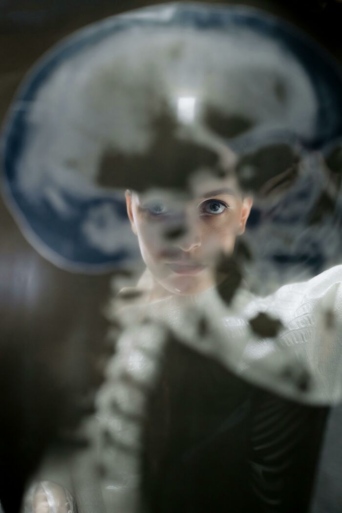 Person looking through a foggy window, symbolizing a lucky survival against all odds.